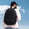 A person wearing a backpack against a sky background. Voir les images du produit