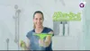 A woman is cleaning a shower with a cleaning tool. Produktbild-Vorschau