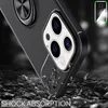 A close-up of a black phone case with a ring holder, resting on a surface of broken pieces, suggesting shock absorption. Produktbild-Vorschau