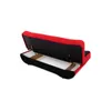 The back of a red and black sofa with the storage compartment open. Náhled obrázku produktu