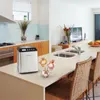 A modern kitchen island with an ice cream maker and bowls of ice cream. Náhled obrázku produktu