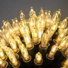 A close-up view of many warm white LED string lights. Produktbild-Vorschau