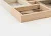 A close-up view of a wooden multi-photo frame on a white surface. Náhled obrázku produktu