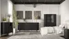 A modern bedroom with black furniture, including a dresser, sideboard, and display cabinet, alongside a bed and decorative elements. Produktbild-Vorschau