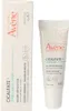A product shot of Avène Cicalfate+ Repair Lip Balm and its packaging. Podgląd zdjęcia produktu