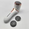 A white electric callus remover with rose gold accents and two circular replacement heads are placed on a light gray and white marbled surface. Produktbild-Vorschau