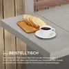 A close-up of a table with bread and coffee, with text describing it as an accessory table. Náhled obrázku produktu
