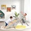 Two young children playing on a wooden climbing set in a brightly decorated room. Podgląd zdjęcia produktu