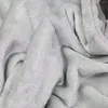 A close-up view of a soft, textured fabric, likely a blanket or similar textile. Anteprima dell’immagine prodotto