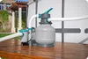 A pool pump and sand filter system sits on a wooden deck next to an inflatable pool. Produktbild-Vorschau
