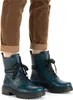 A close-up shot of a person's legs wearing blue lace-up boots and brown corduroy pants. Voir les images du produit