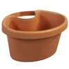 A brown plastic planter pot with a handle. Podgląd zdjęcia produktu