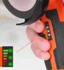 A close-up shot of a hand holding an angle grinder with a battery indicator. Podgląd zdjęcia produktu