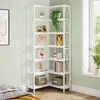 A white corner bookshelf decorated with various items next to a window. Anteprima dell’immagine prodotto