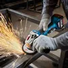 A person wearing work gloves is using a Bosch angle grinder to cut metal, creating a shower of sparks. Náhľad obrázku produktu