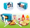 A collage of toy kitchen appliances and food items, including a microwave, yogurt cup, drink cup, ketchup bottle, and juice bottle, along with plates of toy food like croissants, waffles, and donuts. Produktbild-Vorschau
