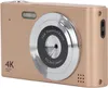 A close-up, angled view of a gold digital camera. Produktbild-Vorschau