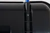 A close-up view of a black plastic object with a blue rod protruding from the top. Náhľad obrázku produktu