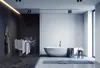 A modern bathroom with a freestanding bathtub, a drying rack with towels, and a towel hanging on the wall. Produktbild-Vorschau