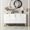 A white sideboard with gold accents and decorative elements on top, set against a neutral wall. Produktbild-Vorschau