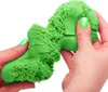 Hands manipulating green kinetic sand. Voir les images du produit