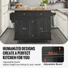 A black kitchen island cart with a wooden top is shown in a kitchen setting, with text overlays highlighting its features. Produktbild-Vorschau