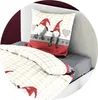 A close-up view of a bed with bedding featuring a gnome pattern. The bedding includes a pillowcase and a duvet cover. The background shows a headboard and a wall. Produktbild-Vorschau