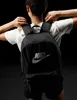 A person wearing a black Nike backpack. Produktbild-Vorschau