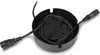 A black circular device with cables and plugs inside, set against a white background. Produktbild-Vorschau