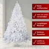A white artificial Christmas tree is shown in a room with a light gray wall and a light wooden floor. Red rectangular boxes with white checkmarks and text are displayed to the right of the tree, highlighting its features. Produktbild-Vorschau