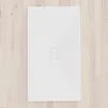 A white shower tray on a light wooden floor. Produktbild-Vorschau