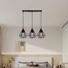A bedroom with a bed and a pendant light fixture. Produktbild-Vorschau