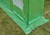 Close-up of the base of a green greenhouse on a grassy lawn. Náhľad obrázku produktu