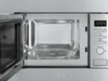 An open microwave oven with a glass turntable inside. Produktbild-Vorschau