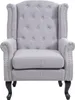 A studio shot of a gray wingback armchair. Náhled obrázku produktu