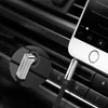 A close-up of a smartphone plugged into a car's audio system using an aux cable. Anteprima dell’immagine prodotto