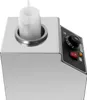 A stainless steel electric sauce warmer with a plastic squeeze bottle inserted. Náhled obrázku produktu