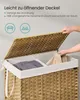A person is opening the lid of a woven laundry basket with two compartments. Produktbild-Vorschau