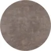 A circular rug with a textured surface. Produktbild-Vorschau