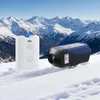 A diesel heater and fuel tank are placed on snow in front of a snowy mountain range. Voir les images du produit