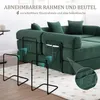 A modular green sofa with black metal frames and side pockets, shown in a living room setting with a rug. Produktbild-Vorschau