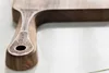 A close-up shot of the handle of a wooden cutting board, showing engraved details and a logo. Anteprima dell’immagine prodotto