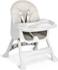 A white high chair with a gray seat cushion and straps, shown from a slightly angled front view on a white background. Produktbild-Vorschau