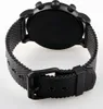 The back view of a black analog watch with a mesh strap. Produktbild-Vorschau