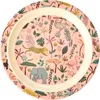 A round plate with a jungle-themed print. Produktbild-Vorschau