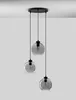 A modern pendant light fixture with three glass globes hanging from a black ceiling mount. Anteprima dell’immagine prodotto