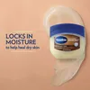 A jar of Vaseline Cocoa Butter Healing Jelly is shown with text overlay promoting its moisturizing properties. Podgląd zdjęcia produktu