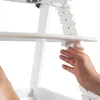 A hand is shown adjusting a white high chair. Náhled obrázku produktu