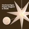 A close-up view of a white paper star lantern with small dots, with a magnified inset showing the texture of the paper. Podgląd zdjęcia produktu