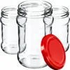 Three empty glass jars with a red lid in front of them, on a white background. Anteprima dell’immagine prodotto